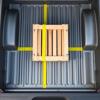 Loader aligning cargo centre of gravity on the truck bed