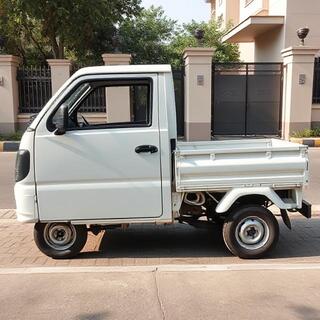 TitanHaul mini-truck turning through a residential lane