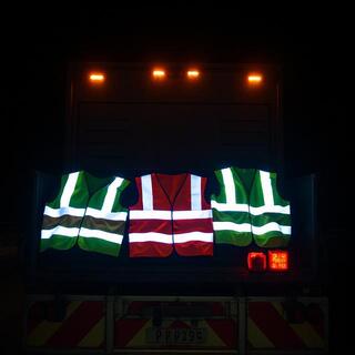 Crew wearing high-visibility vests during a night move